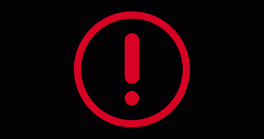 Point d'exclamation rouge dans cercle rouge sur fond noir